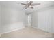 Bedroom displaying carpet, a ceiling fan, two closets, and light gray walls at 9319 Harps Mill Ct, Charlotte, NC 28270