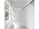 Bright walk-in closet features wire shelving and natural light from a window at 9319 Harps Mill Ct, Charlotte, NC 28270