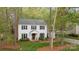 Traditional two-story home with manicured landscaping and a detached carport at 9319 Harps Mill Ct, Charlotte, NC 28270