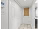 Hallway with closet space, light-colored walls, and easy access to a bathroom at 9319 Harps Mill Ct, Charlotte, NC 28270
