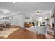 Open-concept living area with dining space and a beautiful brick fireplace at 9319 Harps Mill Ct, Charlotte, NC 28270
