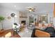 Cozy living room with a brick fireplace, ceiling fan, and stylish furnishings at 9319 Harps Mill Ct, Charlotte, NC 28270