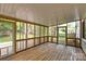Enclosed screened porch with wood floors and screens allows for outdoor enjoyment while providing protection from insects at 9319 Harps Mill Ct, Charlotte, NC 28270