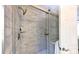 Bright shower features marble subway tile, a glass door, and stainless steel hardware at 9319 Harps Mill Ct, Charlotte, NC 28270