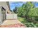 Landscaped backyard with a fence and mature trees to create privacy at 9551 Glenburn Ln, Charlotte, NC 28278