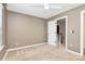 Carpeted bedroom with fan, neutral walls, and white trim at 9551 Glenburn Ln, Charlotte, NC 28278