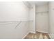 Walk-in closet features built-in shelving to organize clothes and accessories at 9551 Glenburn Ln, Charlotte, NC 28278