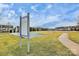 A community recreation area with a sports court, playground rules sign and walkways at 9551 Glenburn Ln, Charlotte, NC 28278