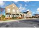 Stone-clad building with covered entryway and manicured landscaping with bright accent plants at 9551 Glenburn Ln, Charlotte, NC 28278