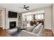 Open concept floor plan of the living room with fireplace, the kitchen, and the dining area at 9551 Glenburn Ln, Charlotte, NC 28278