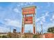 Outlet mall sign featuring prominent store logos with clear blue skies in background at 9551 Glenburn Ln, Charlotte, NC 28278