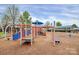Community playground with modern equipment and a soft ground surface, perfect for  at 9551 Glenburn Ln, Charlotte, NC 28278