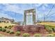 Stone community sign with a list of town center amenities and stores at 9551 Glenburn Ln, Charlotte, NC 28278