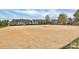 Community sand volleyball court with net set up, surrounded by well-maintained green space at 9551 Glenburn Ln, Charlotte, NC 28278