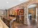 Stylish bar area featuring stone archways, custom lighting, and ample seating at 1012 Shippon Ln, Waxhaw, NC 28173