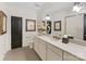 Stylish bathroom featuring a vanity with light countertop, decorative mirror, and neutral color scheme at 1012 Shippon Ln, Waxhaw, NC 28173
