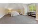 Spacious bedroom with vaulted ceilings, neutral walls, plush carpeting and natural light at 1012 Shippon Ln, Waxhaw, NC 28173