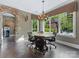 Bright dining area with large windows, complemented by an elegant chandelier, offering scenic views at 1012 Shippon Ln, Waxhaw, NC 28173