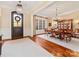 An elegant dining room featuring hardwood floors, large windows, and traditional furnishings at 1012 Shippon Ln, Waxhaw, NC 28173