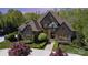 Elegant home featuring brick and stone, manicured landscaping, and a welcoming entrance at 1012 Shippon Ln, Waxhaw, NC 28173