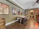 A finished basement game room features a air hockey table and custom wall decor at 1012 Shippon Ln, Waxhaw, NC 28173