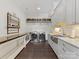 Bright laundry room with modern washer and dryer units, ample counter space and sleek cabinets at 1012 Shippon Ln, Waxhaw, NC 28173