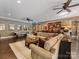 Spacious living room with a bar, stone arches, a pool table and stylish decor, perfect for entertaining at 1012 Shippon Ln, Waxhaw, NC 28173
