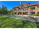 Luxury home featuring a pristine pool, patio, and manicured lawn with lush landscaping at 1012 Shippon Ln, Waxhaw, NC 28173