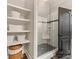 Shower with subway tile, a glass door, bench seating and shelving for added convenience at 1012 Shippon Ln, Waxhaw, NC 28173