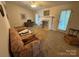 Spacious living room with a decorative fireplace and access to the backyard at 112 Juanita Dr, Pineville, NC 28134
