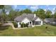 An aerial view of the rear of the house shows the screen porch and well manicured yard at 116 Jim Parker Rd, Wesley Chapel, NC 28110