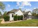 A well-kept backyard features a screened in porch, stainless grill and manicured yard at 116 Jim Parker Rd, Wesley Chapel, NC 28110