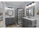 Beautiful bathroom featuring dual vanities and black framed glass shower at 116 Jim Parker Rd, Wesley Chapel, NC 28110