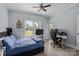 This naturally lit bedroom features a gaming setup, and a door to the outside at 116 Jim Parker Rd, Wesley Chapel, NC 28110