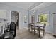 Bright dining area with hardwood floors and large windows overlooking backyard at 116 Jim Parker Rd, Wesley Chapel, NC 28110
