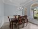 Elegant dining room with large arched windows and a classic chandelier at 116 Jim Parker Rd, Wesley Chapel, NC 28110