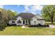 Charming single-story home with a well-manicured lawn and beautiful landscaping at 116 Jim Parker Rd, Wesley Chapel, NC 28110