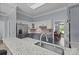 Kitchen features stainless steel appliances, breakfast bar, and adjacent dining area at 116 Jim Parker Rd, Wesley Chapel, NC 28110