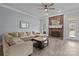 Comfortable living room with a brick fireplace and neutral decor at 116 Jim Parker Rd, Wesley Chapel, NC 28110
