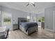 Large main bedroom with many windows, ceiling fan and tray ceiling at 116 Jim Parker Rd, Wesley Chapel, NC 28110