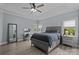 Spacious main bedroom with tray ceiling, ceiling fan, and large windows at 116 Jim Parker Rd, Wesley Chapel, NC 28110