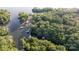 Stunning aerial view of a lakefront property surrounded by lush greenery and private docks at 119 Harbor Ln, Mount Gilead, NC 27306