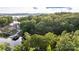 Aerial shot showcases the house nestled among trees with lake access at 119 Harbor Ln, Mount Gilead, NC 27306