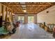 Spacious unfinished basement with exposed beams and sliding glass doors to the outside at 119 Harbor Ln, Mount Gilead, NC 27306