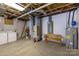Basement with utilities, water heater, and electrical panel and a wooden bench at 119 Harbor Ln, Mount Gilead, NC 27306