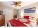 Cozy bedroom with a ceiling fan, neutral walls, and rustic wooden furniture at 119 Harbor Ln, Mount Gilead, NC 27306