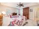 Warm bedroom with a bed, ceiling fan, and a wooden armoire for ample storage at 119 Harbor Ln, Mount Gilead, NC 27306