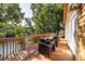 Large wooden deck with wicker seating and beautiful lake views at 119 Harbor Ln, Mount Gilead, NC 27306