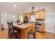 Charming kitchen with stainless steel appliances and an island with barstool seating at 119 Harbor Ln, Mount Gilead, NC 27306