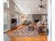 Spacious living room with a fireplace, hardwood floors, and deck access at 119 Harbor Ln, Mount Gilead, NC 27306